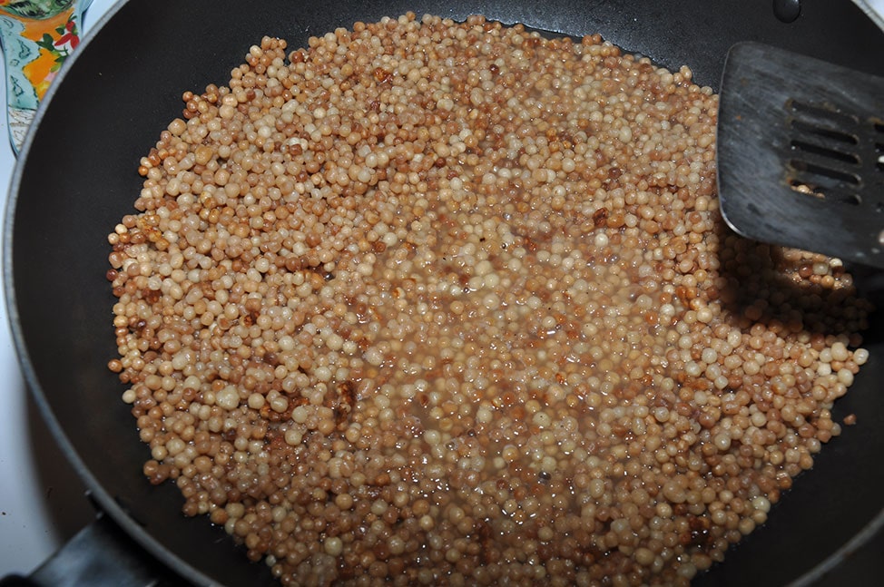 Cooked Moghrabieh in a wok
