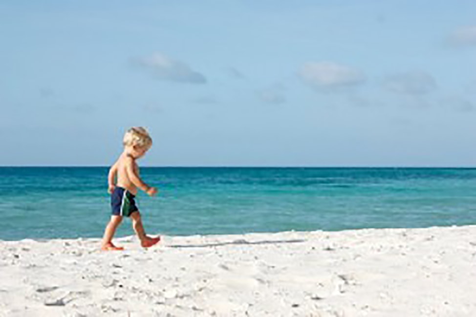 Boy alone on the beach