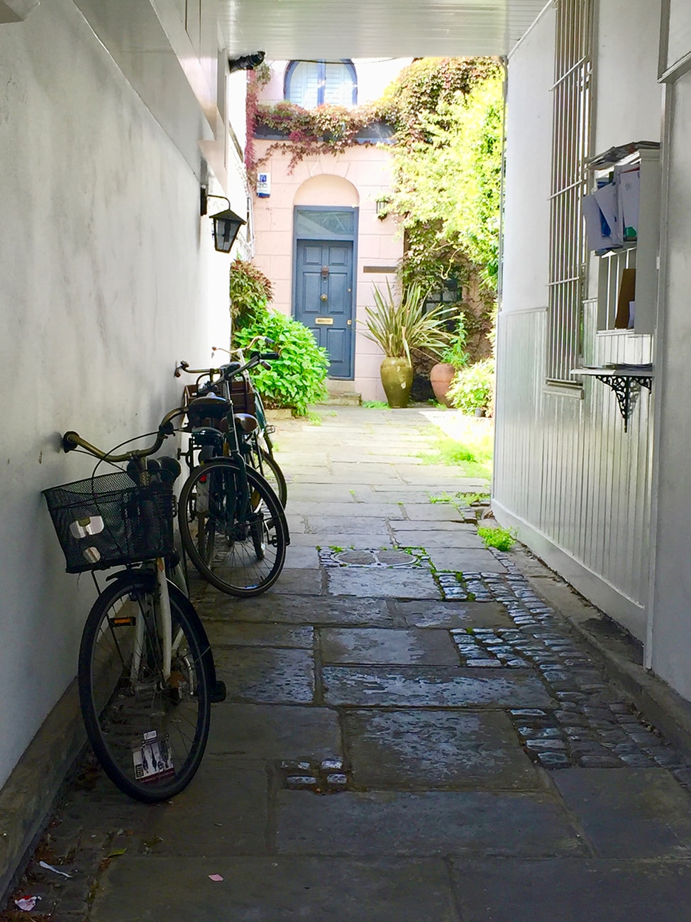 Bicycles and blue door in a London mews