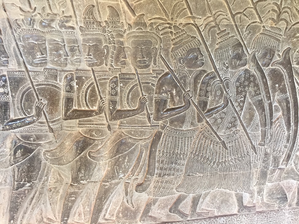 Carving at Angkor Wat of Cambodian and Thai warriors