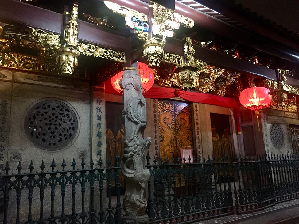 Red lanterns light up a shrine in the Central Business District of Singapore