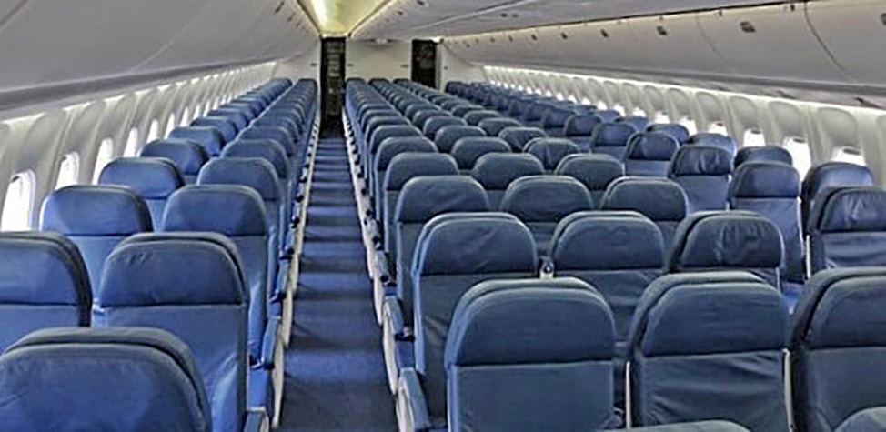 Travel Tips: Confirm your seat assignment before you go. Empty rows of blue seats on an airplane