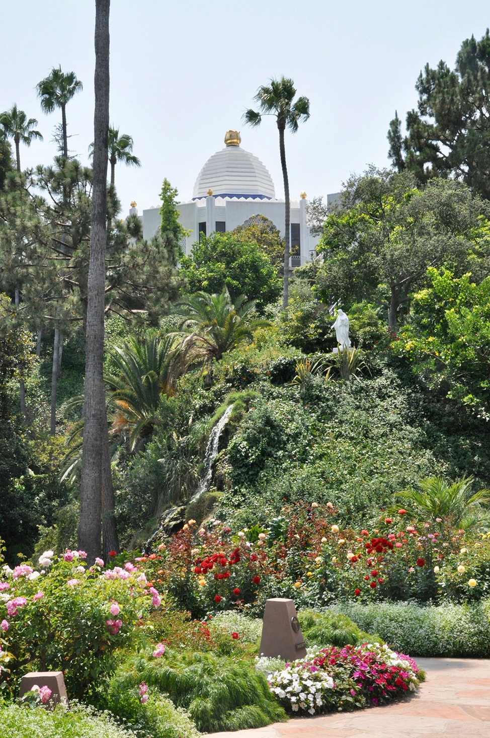 The gold, white and blue dome of the main chapel sits on a hill overlooking the Lake Shrine in Malibu