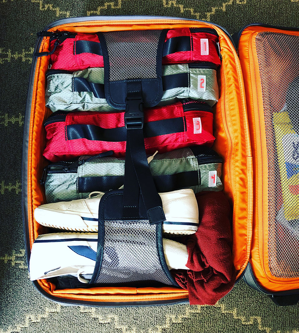 My Compass Rose Packing Cubes fit perfectly in my carry on luggage and keep my capoeira clothes separate from my other clothes.