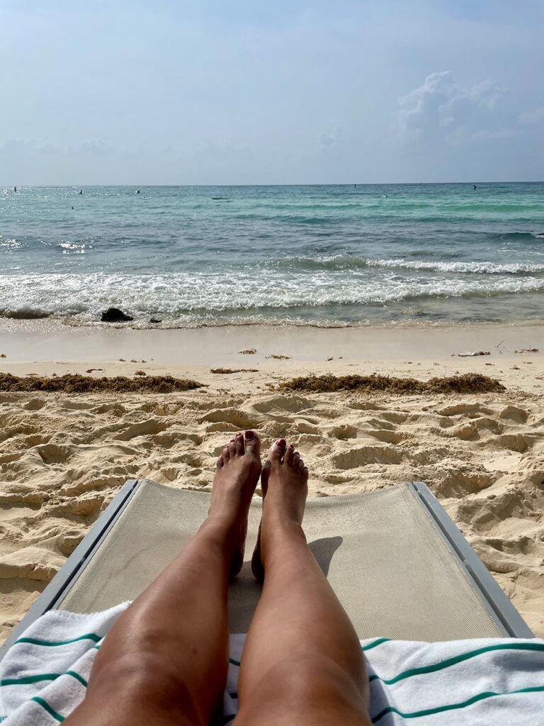 View of the Caribbean Sea and the sand from my beach lounge chair. 