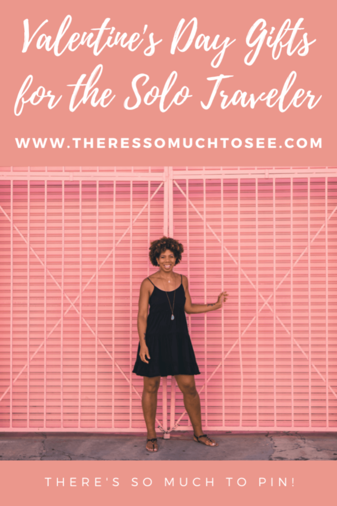 Image of a Black Woman in a black dress against a pink grate backdrop.
